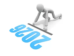 2026の文字のスタートラインでクラウチングスタートの構えをする白い3Dの人物