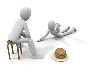 座っている人の前にあるハンバーガーに向かって倒れて手を伸ばす白い3Dの人物