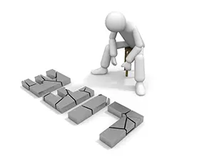 崩れたHELPの文字ブロックの前で力なく座り込んでいる白い3Dの人物